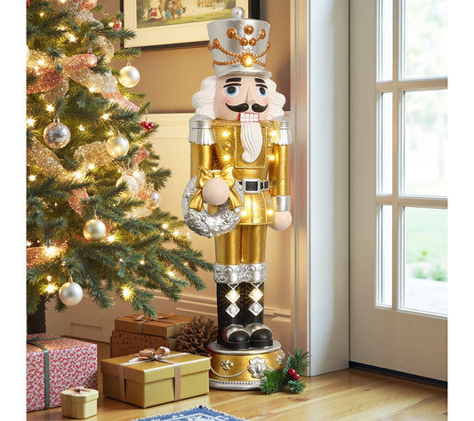 LuxenHome 4ft Lighted Gold Nutcracker with Silver Wreath